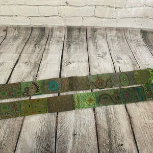 Two green ornate curtain tassels